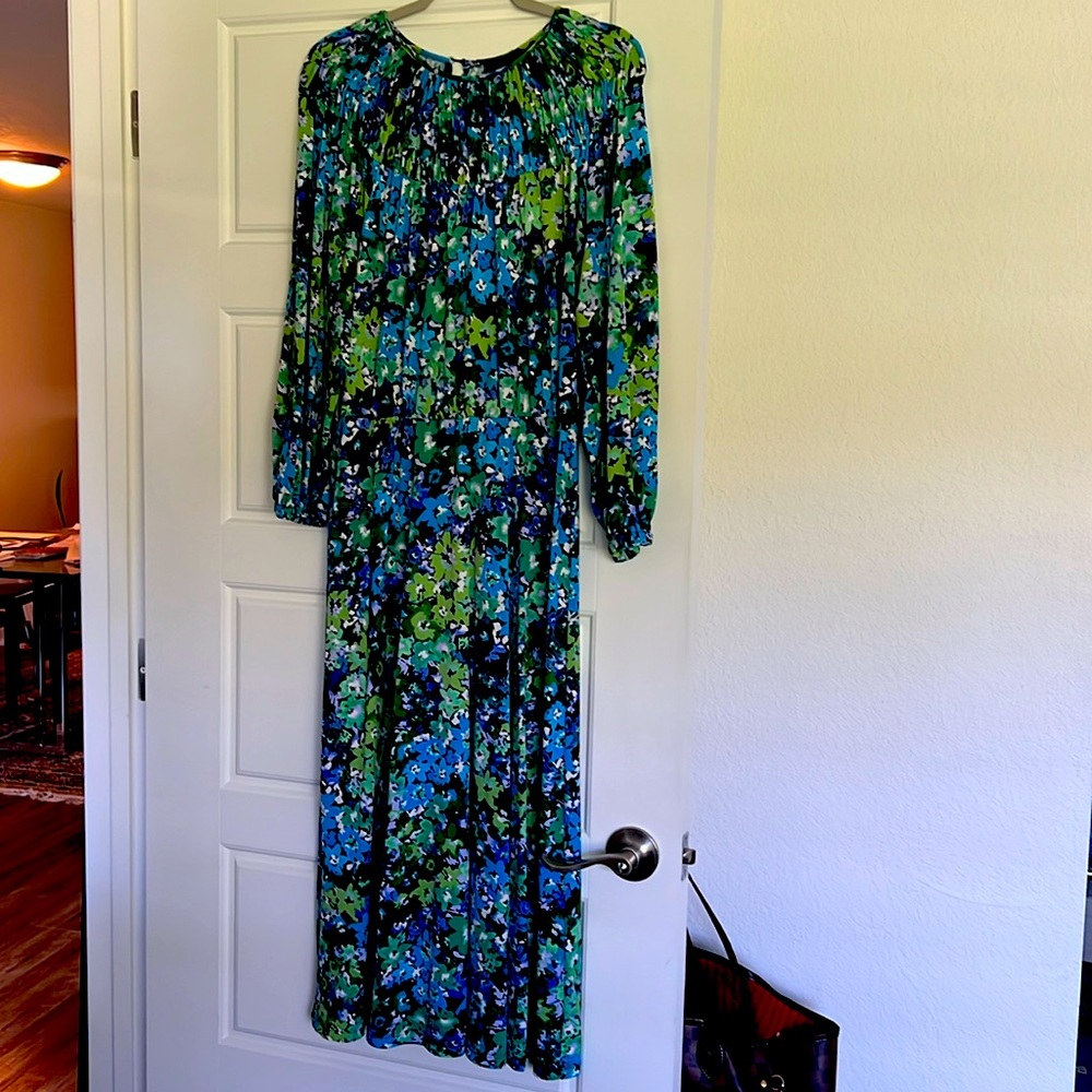 Floral dress with smocked accents at neckline.